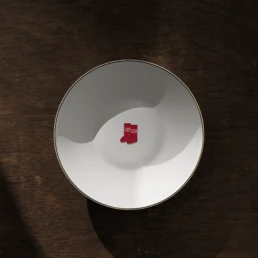 Moonboots emoji on a porcelain plate