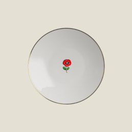 Beefbar x Bernardaud porcelain plate with gold rim and red poppy flower emoji